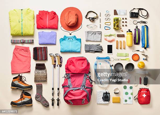 mountain climbing supplies shot knolling style - colorful shoes ストックフォトと画像
