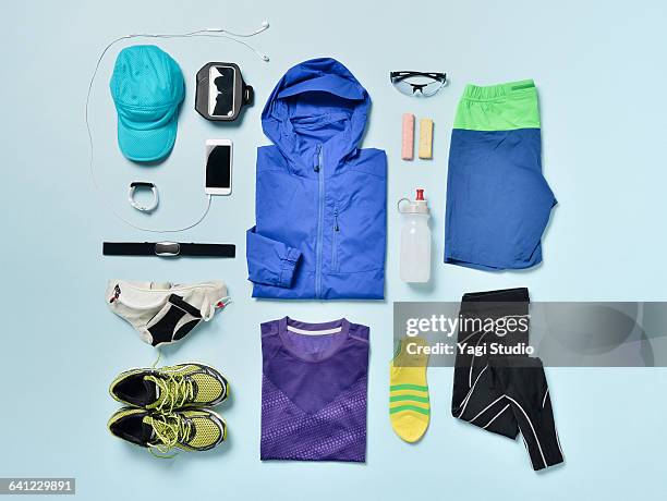 men's jogging supplies shot knolling style. - blue pants stock-fotos und bilder