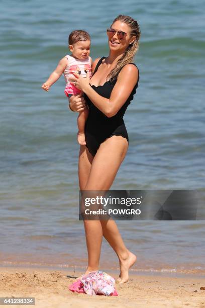 David Warner and wife Candice Falzon pictured with their kids Ivy and Indi at a Sydney beach on January 30, 2017 in Sydney, Australia.