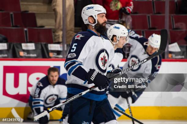 Mark Stuart of the Winnipeg Jets warms up prior to the game against the Chicago Blackhawks at the United Center on January 26, 2017 in Chicago,...