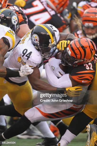 Jeremy Hill of the Cincinnati Bengals runs the football upfield against Lawrence Timmons of the Pittsburgh Steelers during their game at Paul Brown...