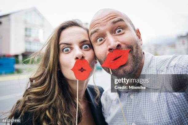 happy couple making jokes - big lips stock pictures, royalty-free photos & images
