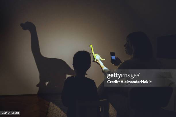 dinosaur in my room - shadow puppets stock pictures, royalty-free photos & images