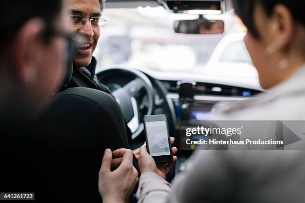 business people talking to taxi driver - car driver ストックフォトと画像