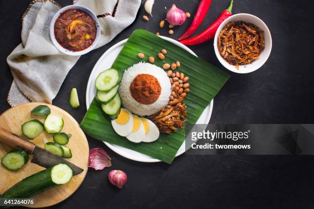 malaysian food "nasi lemak". - traditional malay food stock pictures, royalty-free photos & images