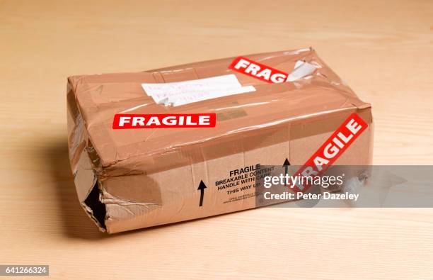 damaged package - fragility fracture stock pictures, royalty-free photos & images