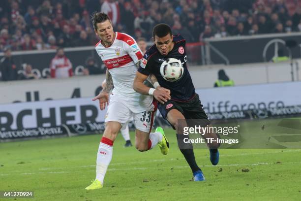 Daniel Gincek of Stuttgart and Kevn Akpoguma of Fortuna Duesseldorf battle for the ball during the Second Bundesliga match between VfB Stuttgart and...
