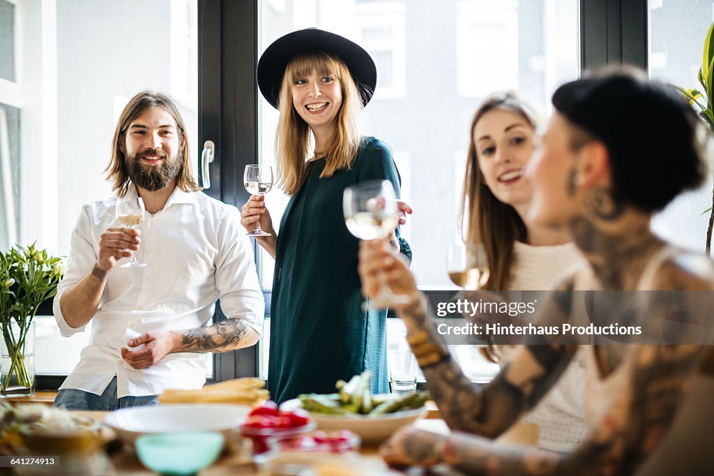 Group of friends drinking glass of wine