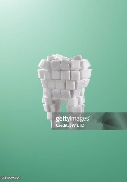 tooth made from sugar cubes - dental filling stockfoto's en -beelden
