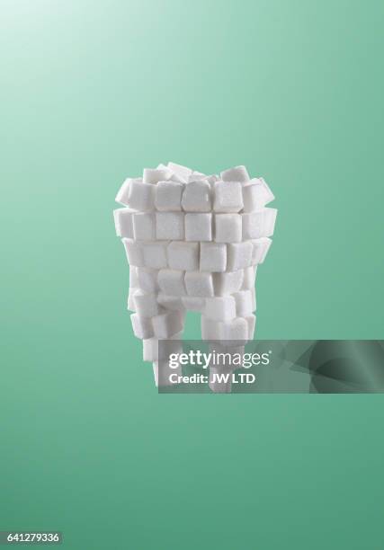 tooth made from sugar cubes - sugar cube stock pictures, royalty-free photos & images