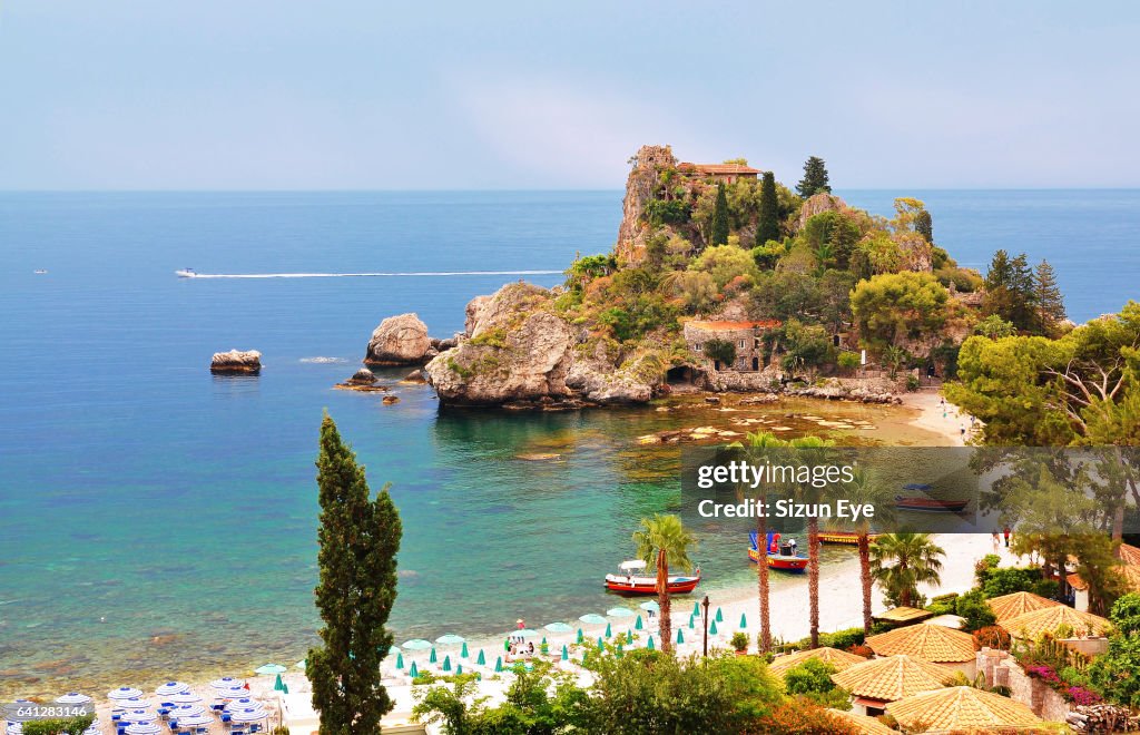 Beautiful coast with Isola Bella in Sicily, Italy.