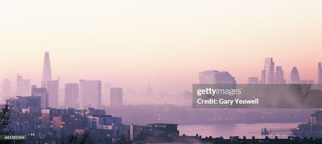 London city skyline and River Thames in the fog