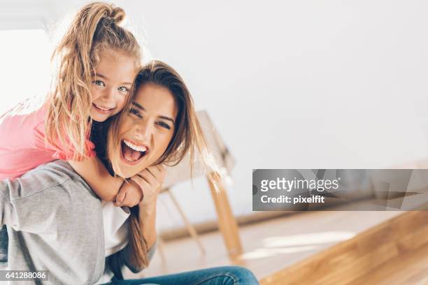 mother and daughther happy together - family with one child stock pictures, royalty-free photos & images