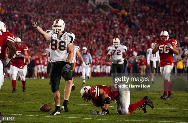 Jeremy Shockey of Miami celebrates after a catch over Scott Shanle of Nebraska during the Rose Bowl National Championship game at the Rose Bowl in...