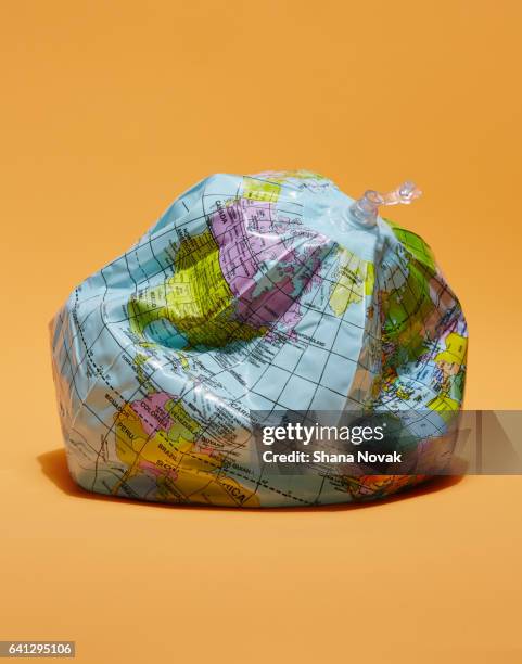deflated globe - environmental protection agency stock-fotos und bilder