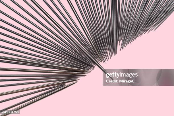 abundance of sewing needles and pins - threading stock pictures, royalty-free photos & images