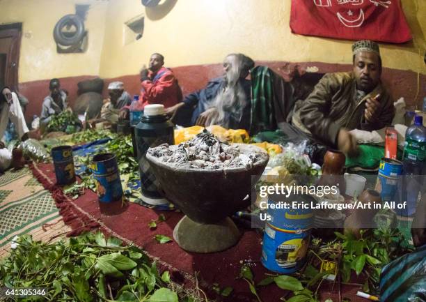Ethiopian people chewing khat during a sufi ceremony lead by Amir Redwan in Ummi Tahir Nabigar on January 12, 2017 in Harar, Ethiopia.