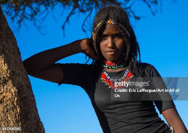 Portrait of an Afar tribe girl with braided hair on January 17, 2017 in Chifra, Ethiopia.