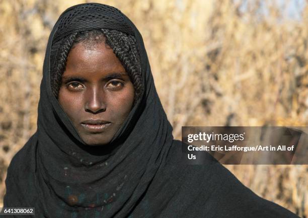 Portrait of an Afar tribe girl with braided hair on January 21, 2017 in Chifra, Ethiopia.