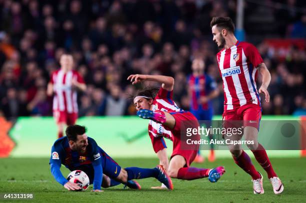 Filipe Luis of Atletico de Madrid fouls Lionel Messi of FC Barcelona during the Copa del Rey semi-final second leg match between FC Barcelona and...