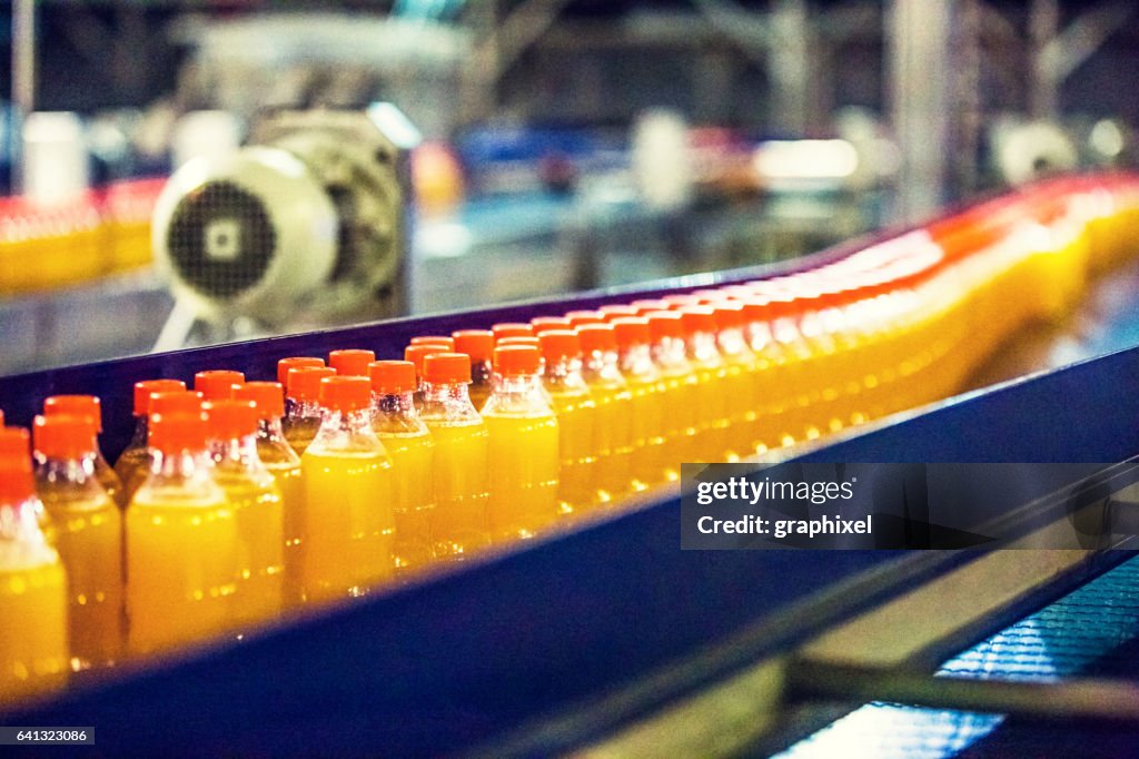 Bottles on Conveyor Belt in Factory