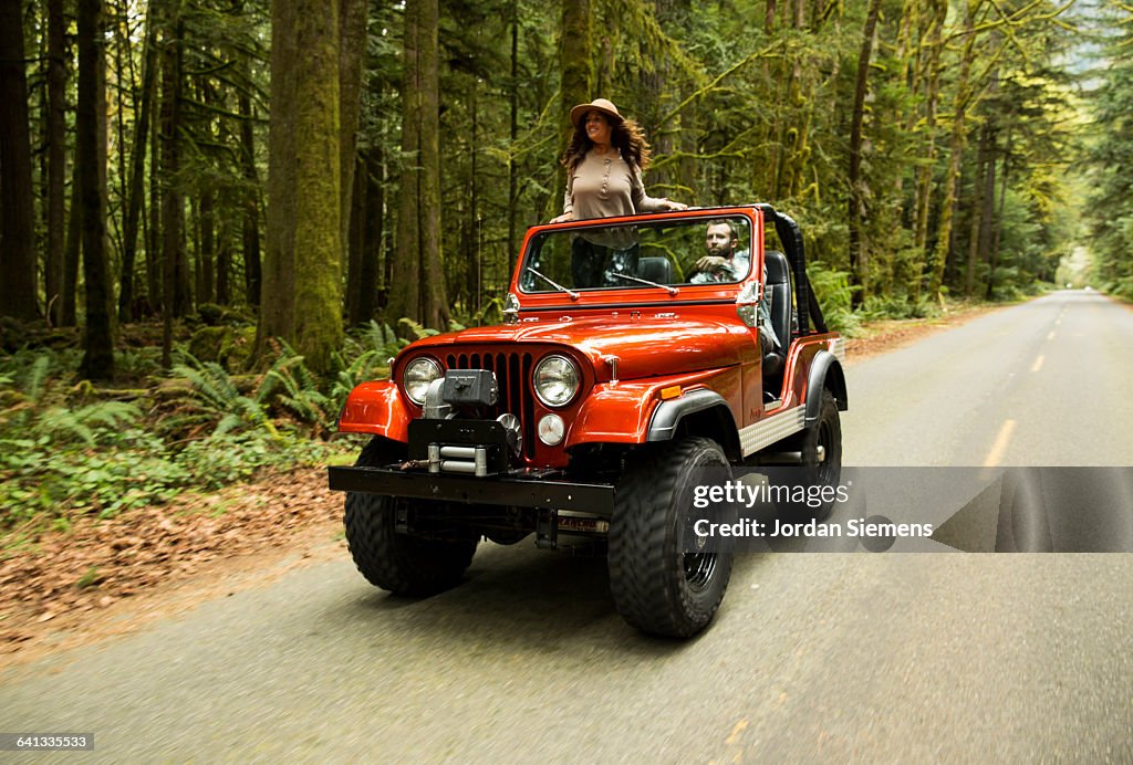 A couple in a convertible.