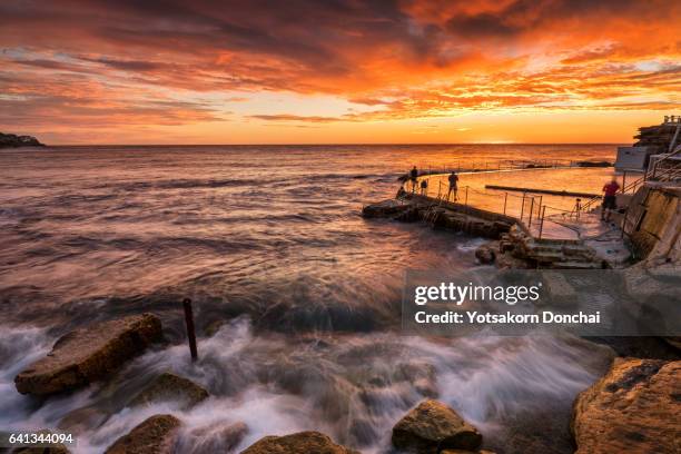 epic sunrise at bronte beach, sydney - bay of water stock pictures, royalty-free photos & images