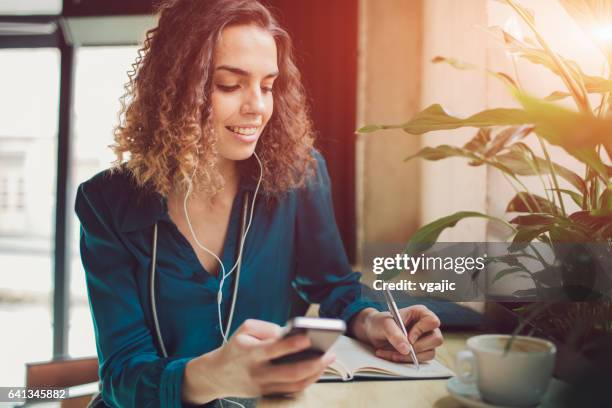 businesswoman in cafe - left handed stock pictures, royalty-free photos & images