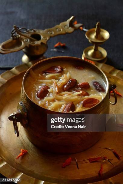 vermicelli pudding/vermicelli kheer/semiya payasam  in a brass utensil - vermicelli stock-fotos und bilder