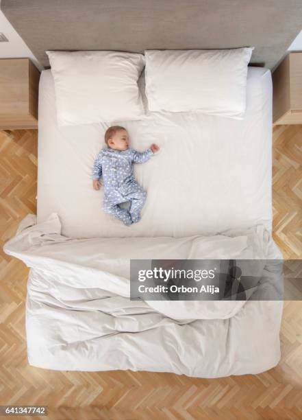 family in bed - bed overhead view stock pictures, royalty-free photos & images