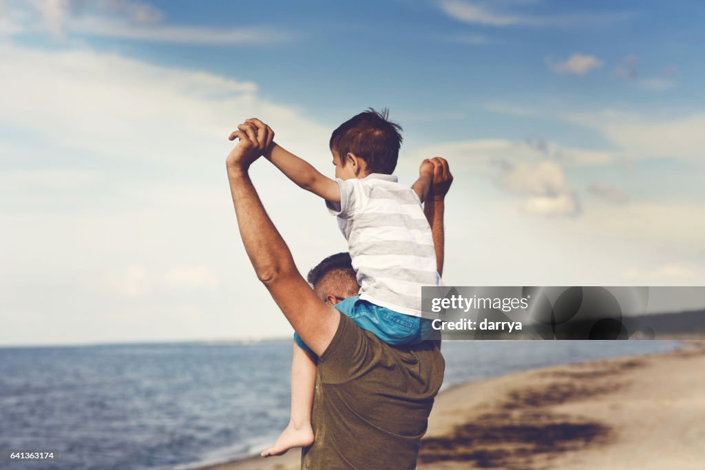 Dad and son enjoying the sea views