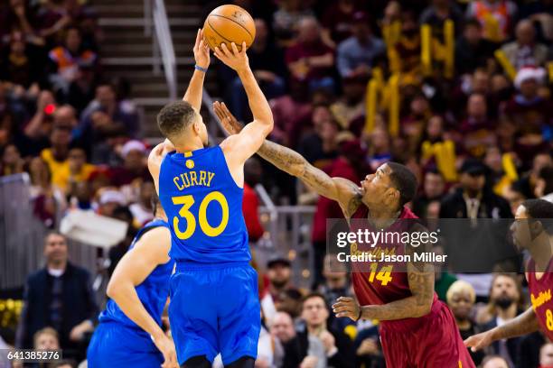 Stephen Curry of the Golden State Warriors shoots over DeAndre Liggins of the Cleveland Cavaliers during the second half at Quicken Loans Arena on...