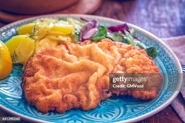 eating wiener schnitzel - cutlet stock pictures, royalty-free photos & images