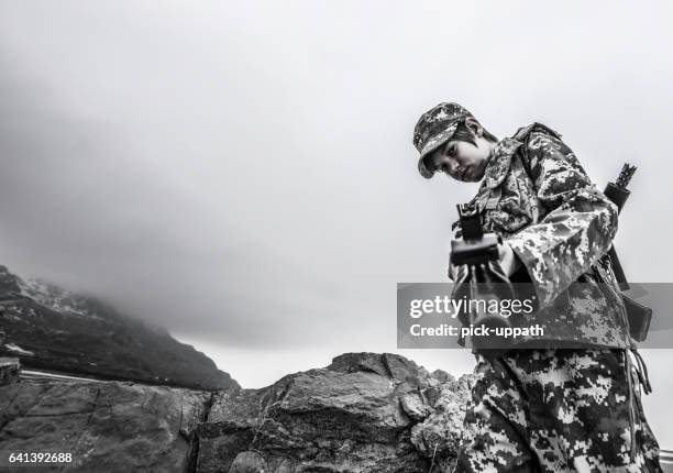 boy playing virtual reality - first person shooter stock pictures, royalty-free photos & images
