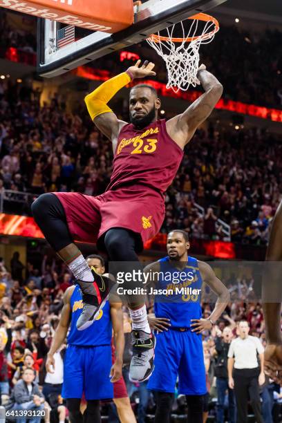 LeBron James of the Cleveland Cavaliers dunks during the second half against the Golden State Warriorsat Quicken Loans Arena on December 25, 2016 in...