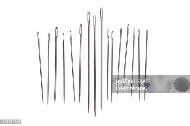 sewing needles on white background - needle stock pictures, royalty-free photos & images