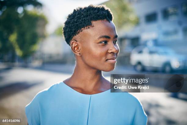 young happy woman in the city - light blue - fotografias e filmes do acervo