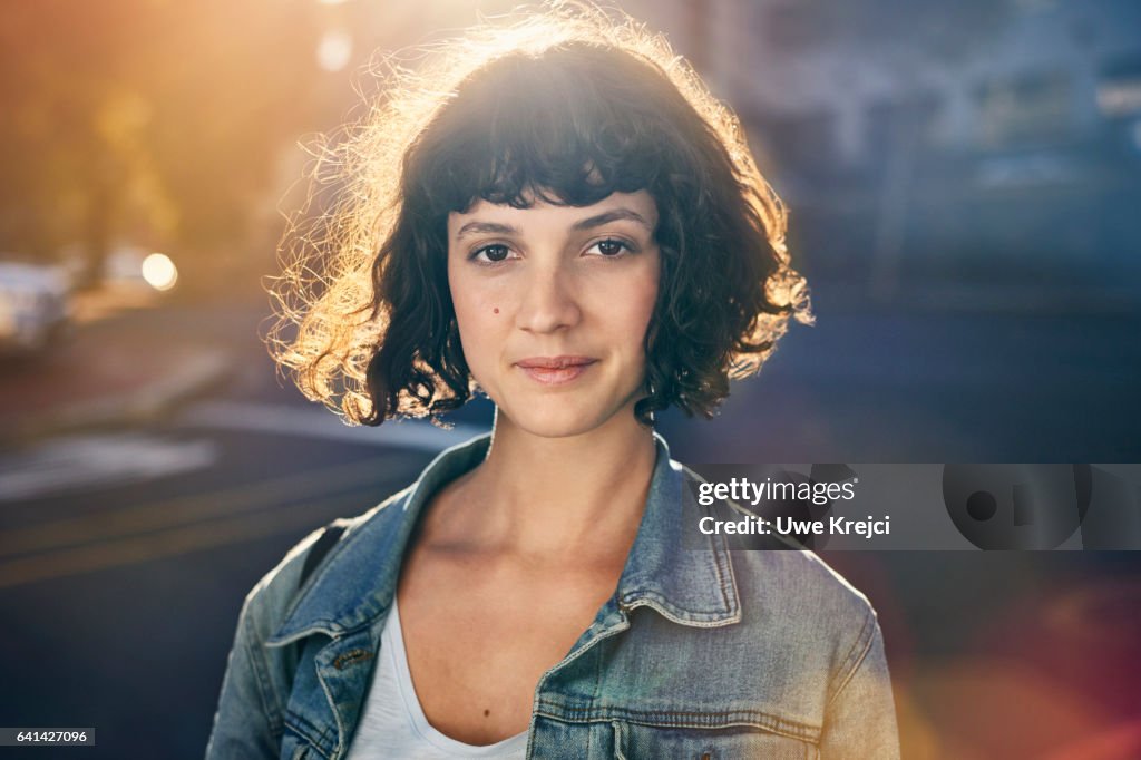 Portrait of young woman in the city