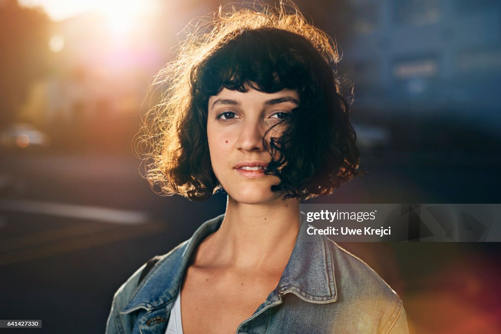 Portrait of young woman in the city