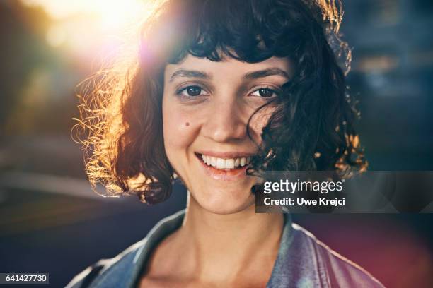 young woman smiling - leanincollection stock pictures, royalty-free photos & images