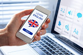 Learn English language online concept, mobile phone, flag of UK