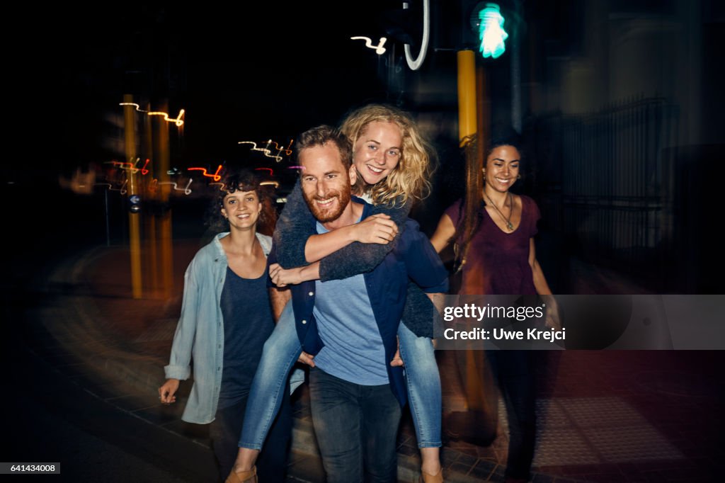 Group of young people having fun at night