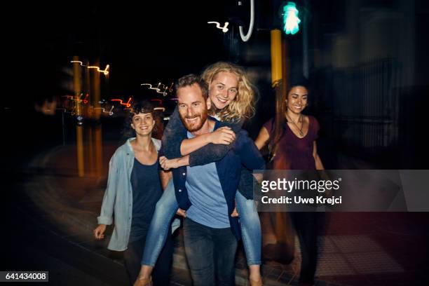 group of young people having fun at night - city life authentic stock pictures, royalty-free photos & images