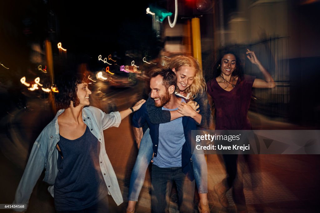 Group of young people in the city at night
