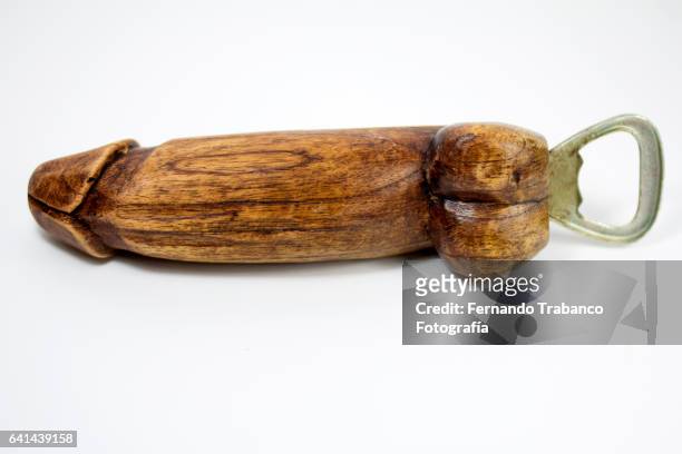 wooden bottle opener with penis shape - penis humour stock pictures, royalty-free photos & images