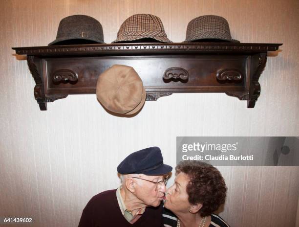 old couple kissing - couple kissing stock-fotos und bilder