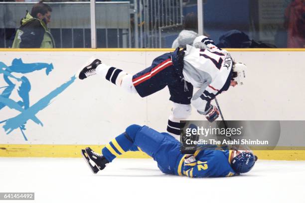 Jeremy Roenick of the United States and Michael Nylander of Sweden compete for the puck during the Ice Hockey Men's Group C match between Sweeden and...