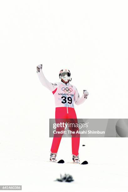 Takanobu Okabe of Japan reacts after competing in the first jump of the Ski Jumping Individual Large Hill during day eight of the Nagano Winter...