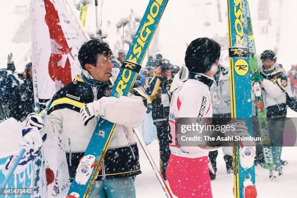 Masahiko Harada and Takanobu Okabe of Japan celebrate winning the gold medal in the Ski Jumping Team during day ten of the Nagano Winter Olympic...