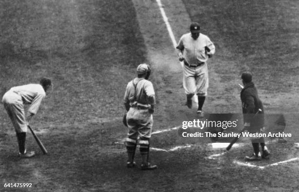 Babe Ruth coming to home plate after hitting a home run in game seven of the 1926 World Series , at Yankee Stadium, Bronx, New York, October 10, 1927.